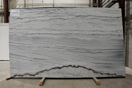 Large slab of gray marble with visible veins on display