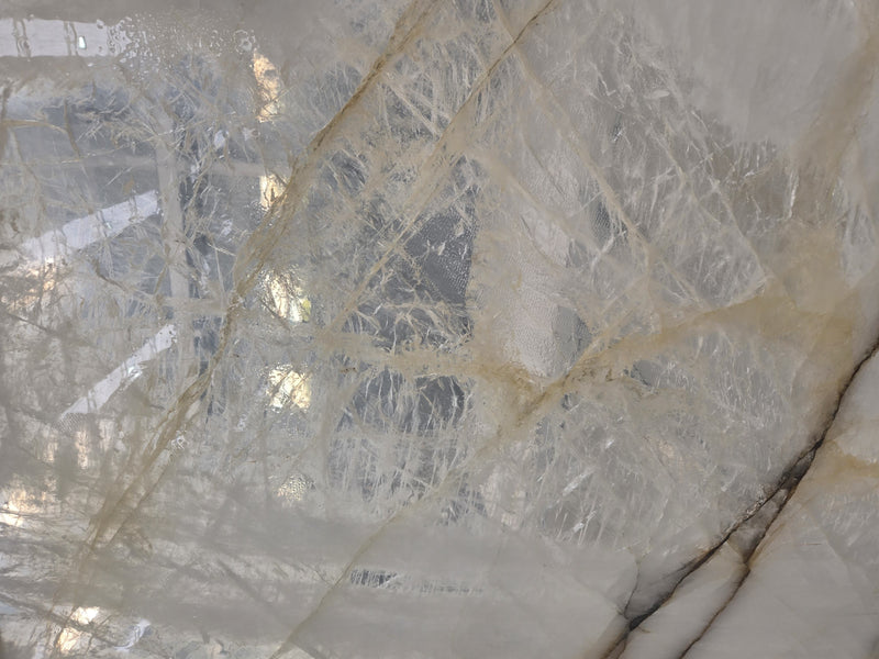 Close-up of a marble or stone surface with gray and beige patterns