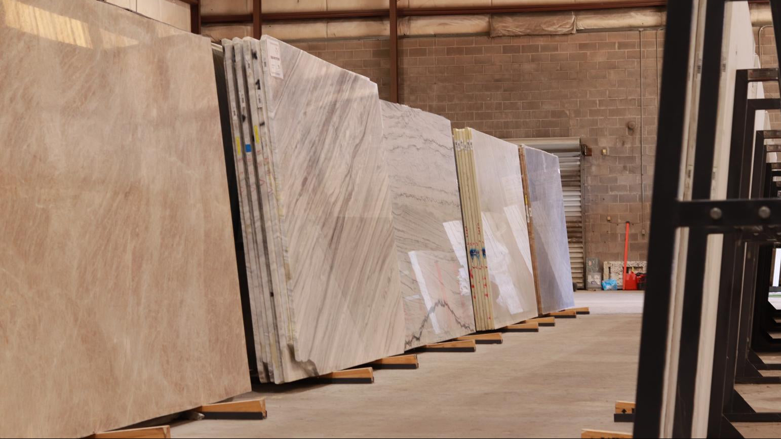 Row of stone slabs in a warehouse setting